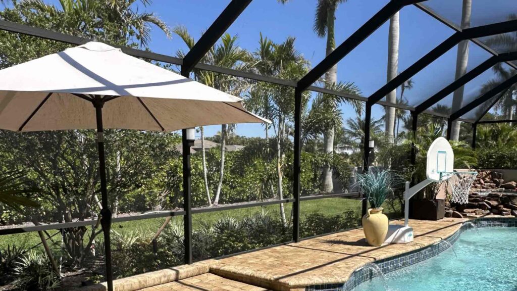 Pool-cage-pressure-washing-side-view-by-Goldmillio-Aug-03-2025